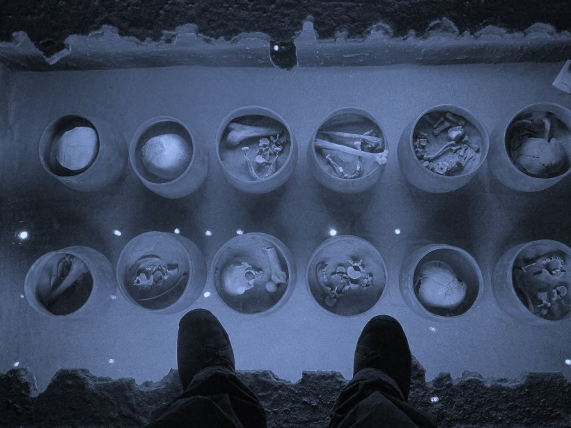 Rich standing over the ancients