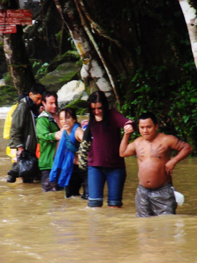 The guide leading the last few through the sunken path