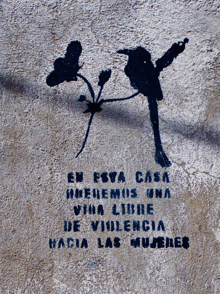 Anti Domestic violence stencils are outside most houses in Suchitoto